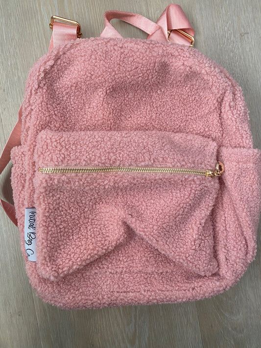 Pink backpack ** SIDE TAG SLIGHTLY SEWN INTO BAG**