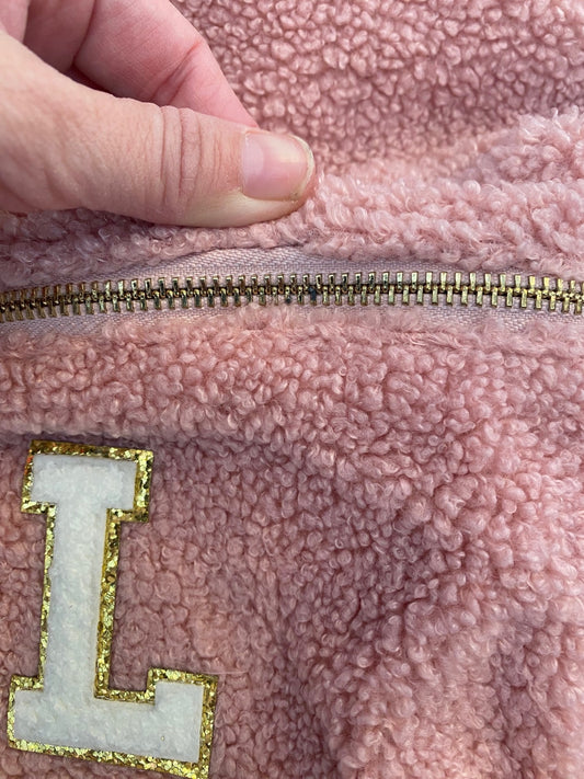 Pink backpack with initial 'L' ** BLACK MARK ON ZIP**