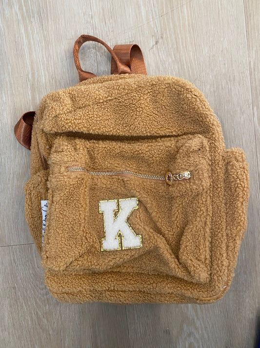 Brown backpack with initial 'K' ** RIGHT SIDE POCKET SLIGHTLY LARGER THEN LEFT**