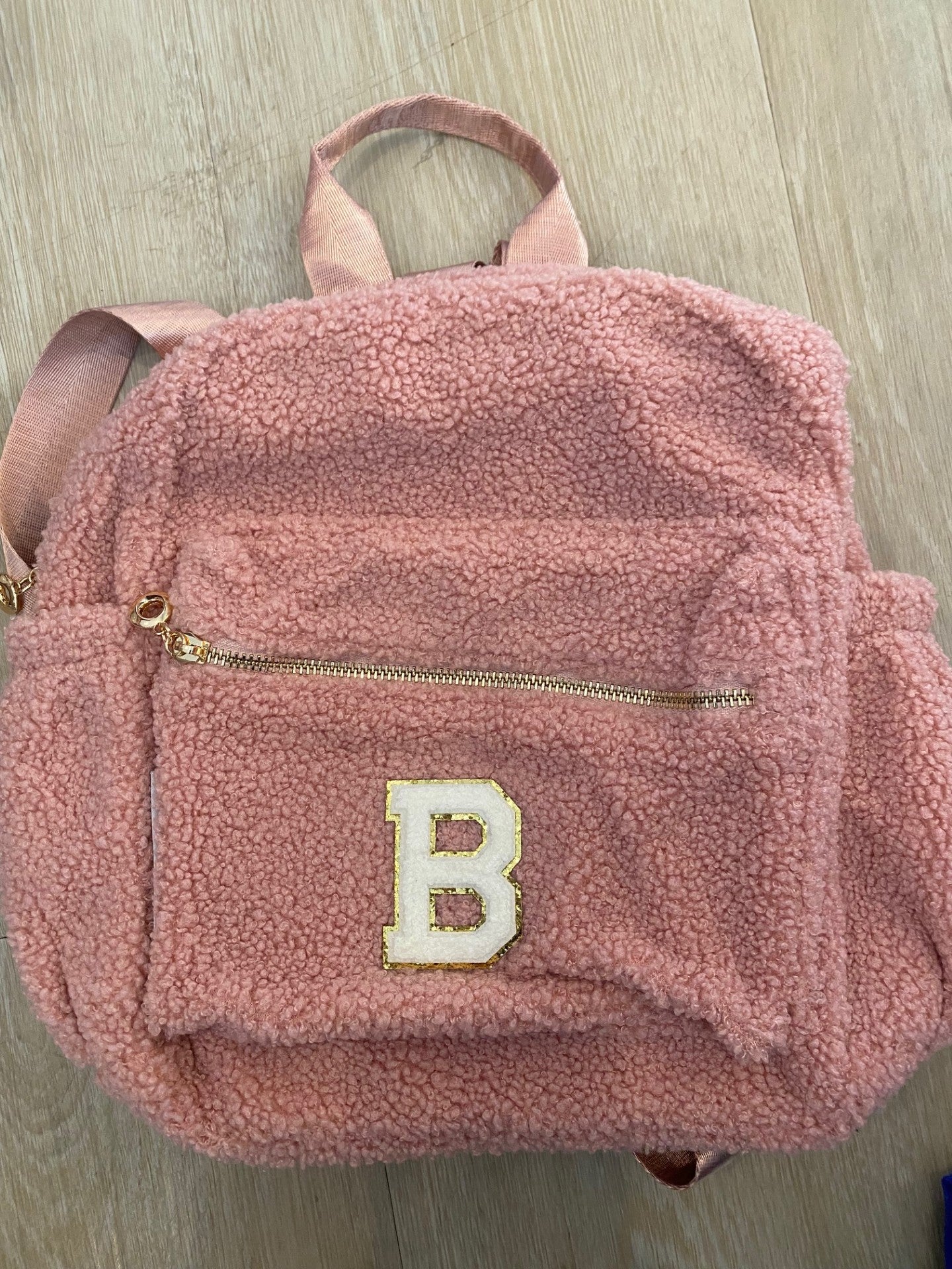 Pink backpack with initial 'B' ** FRONT POCKET ZIP NOT STRAIGHT**