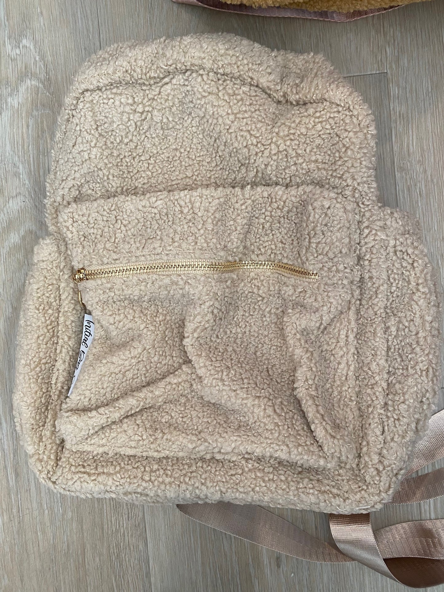 Beige backpack **TOP MATERIAL HAS SLIGHT TEAR**